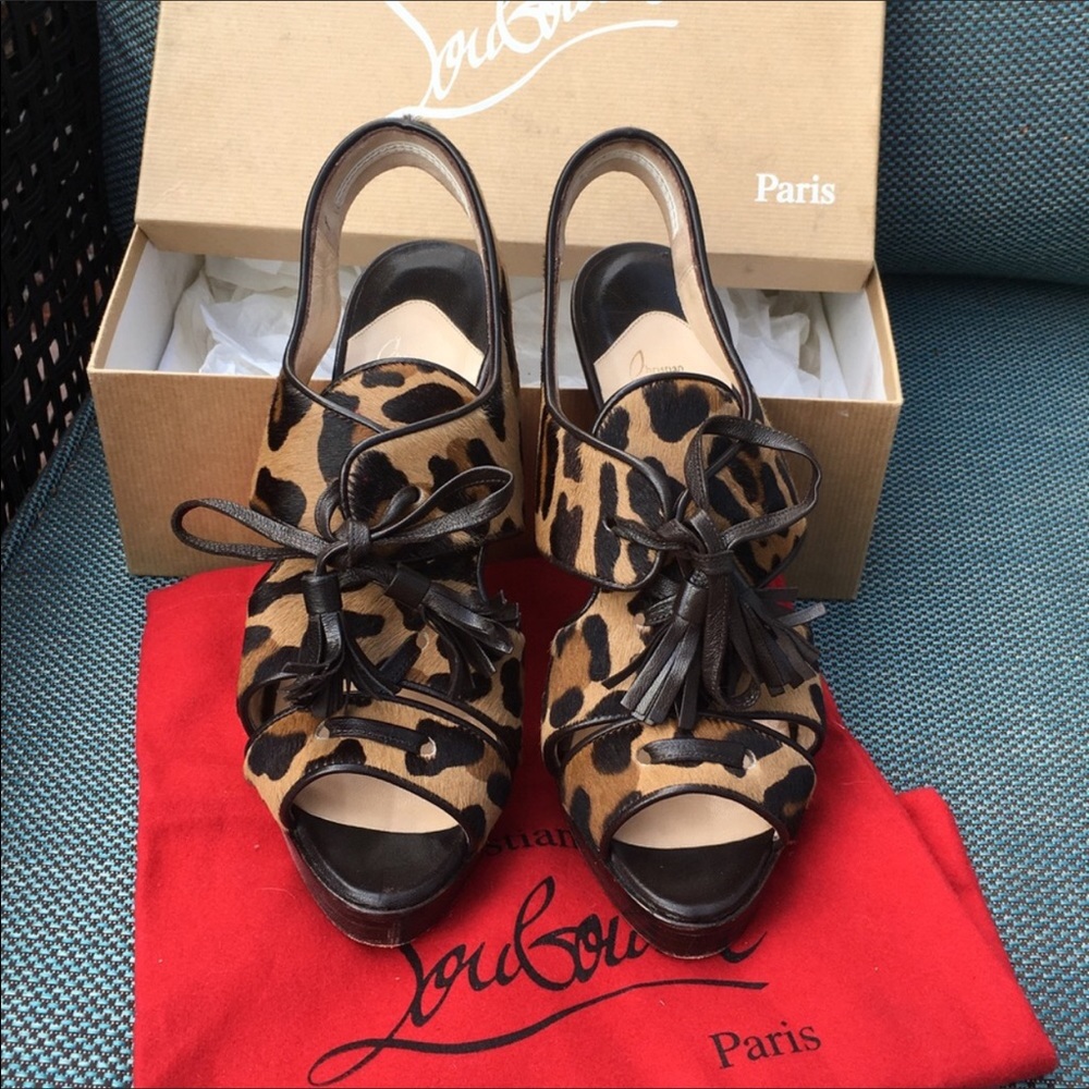 Christian Louboutins lace up heels. No box